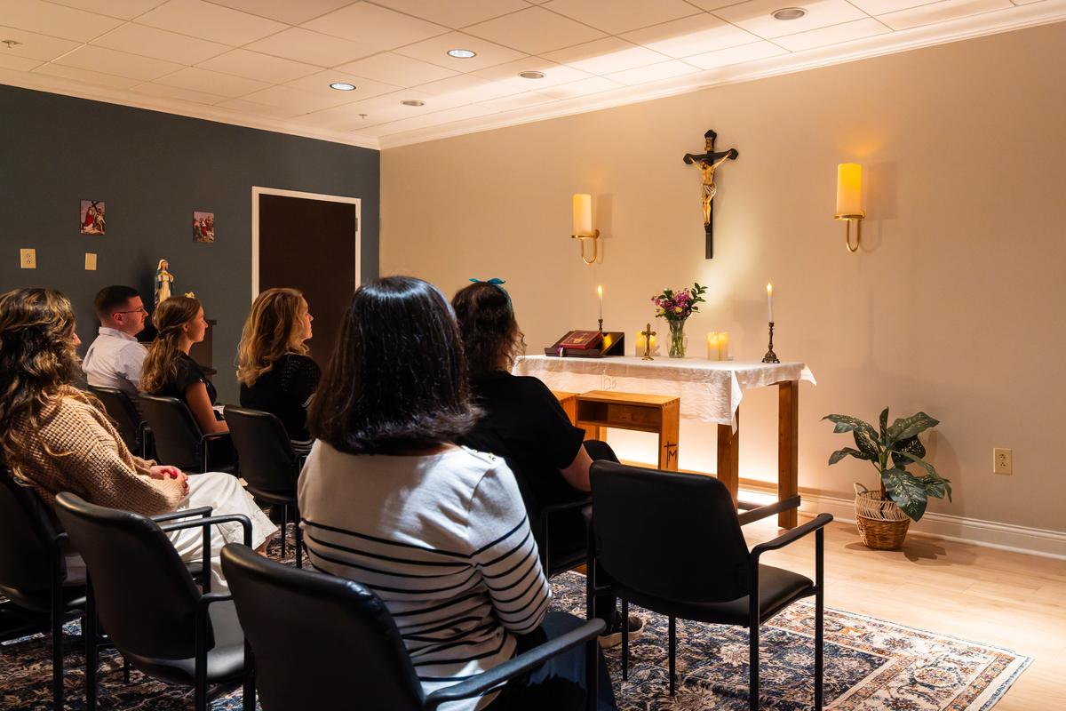Patients and staff gathered in prayer in the Fiat chapel