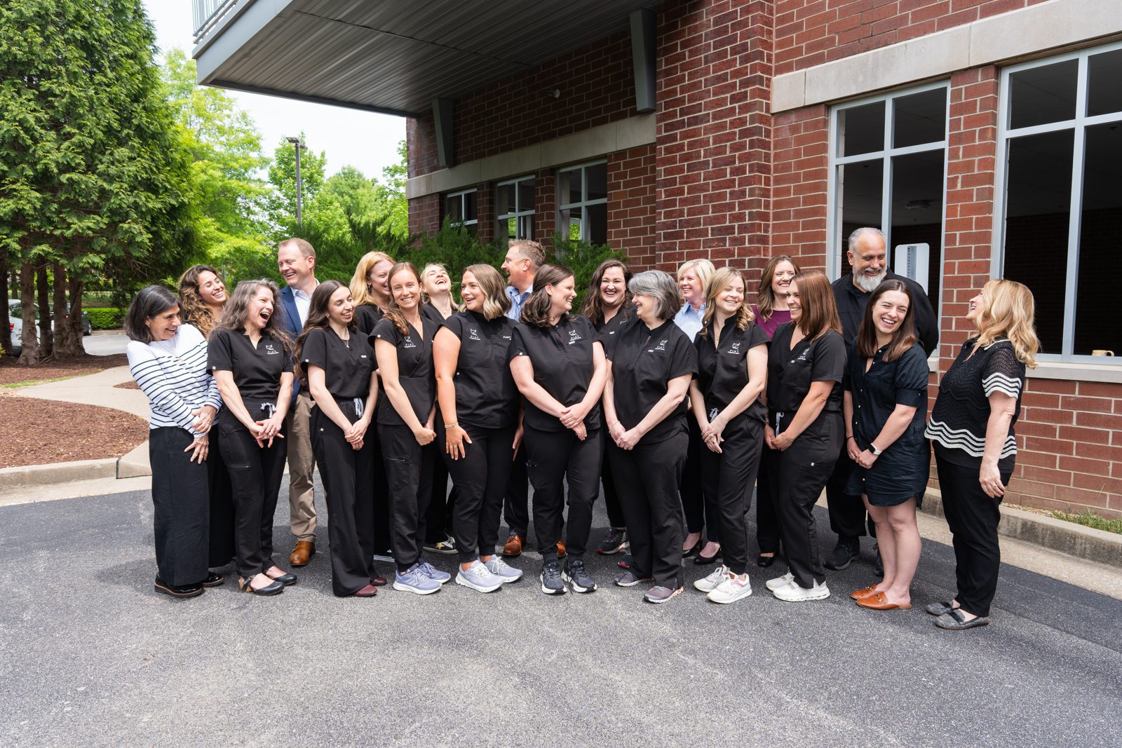The Fiat Integrative Health team standing together outside the Franklin office